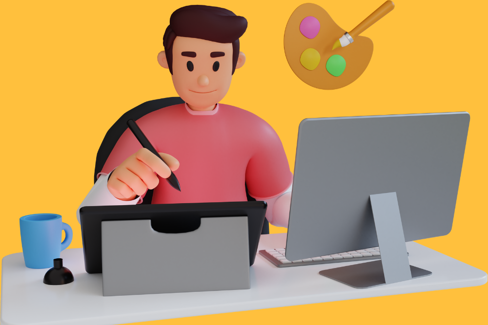 A person in a red shirt working on a graphics tablet with a stylus, sitting in front of a laptop on a white desk. There is a blue mug, an inkwell, a floating artist's palette with a brush, and a smartphone beside the laptop. The background is a solid orange-yellow color.